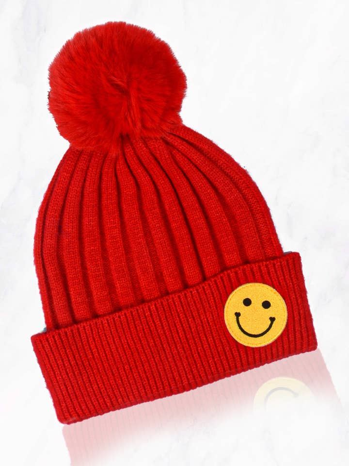 Berretto con pompon Smile Face per la vendita all'ingrosso da parte di Suzie Q USA