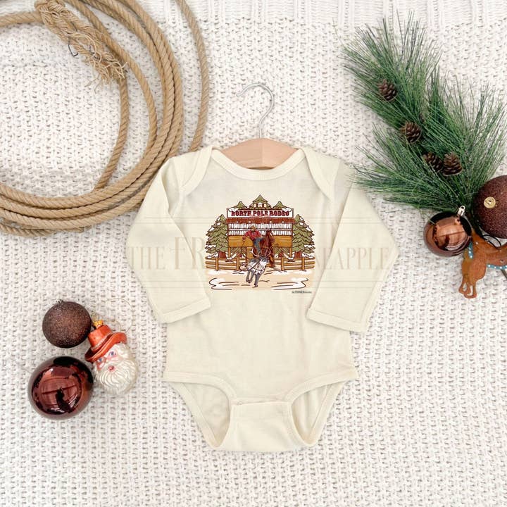 The Fringed Pineapple - Wholesale Screen Printed T-Shirt - Baby - Cream "Christmas Tiedown Roper" Onesie