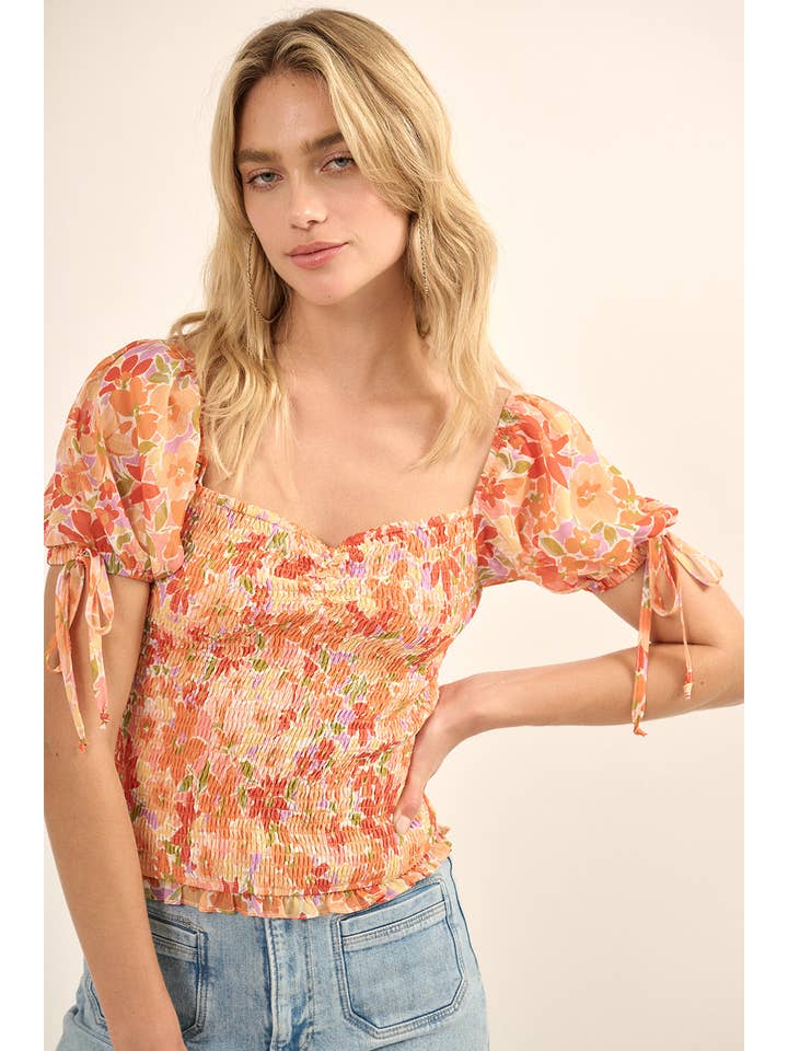 SUNBAKED Smocked Floral Ruffled Puff-Sleeve Peasant Top for wholesale on Faire