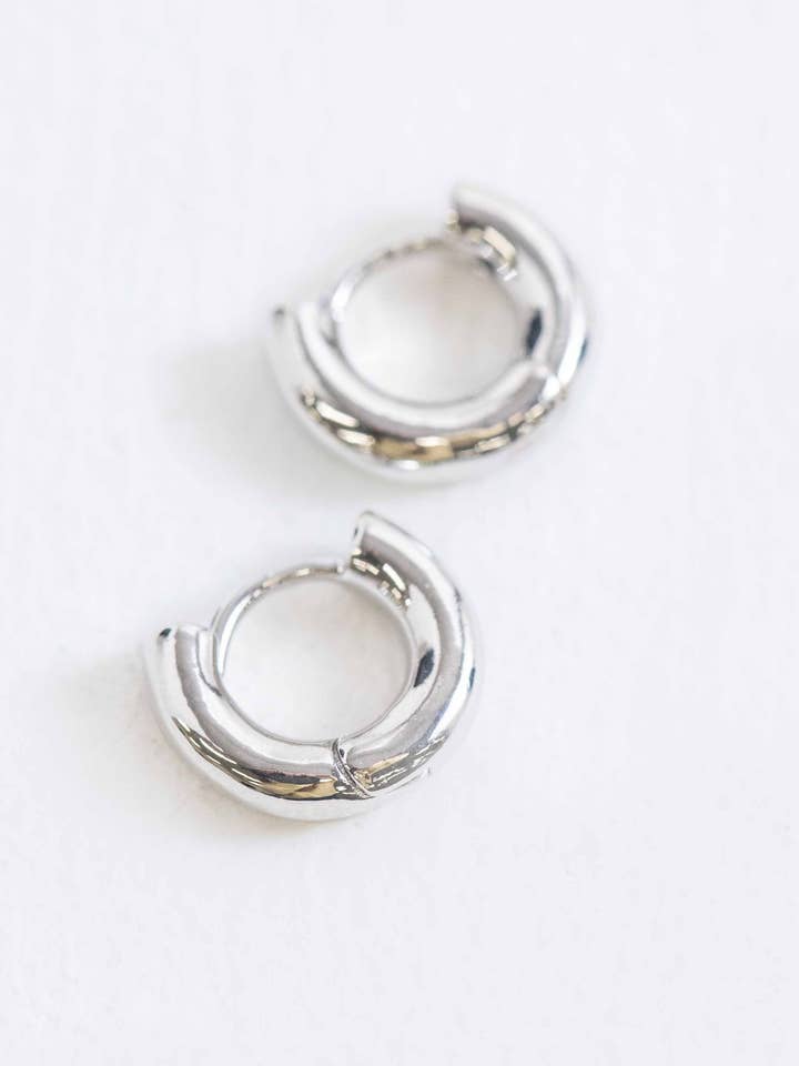 Mini Bolded Huggie Hoop Earrings | Silver for wholesale by Lovoda