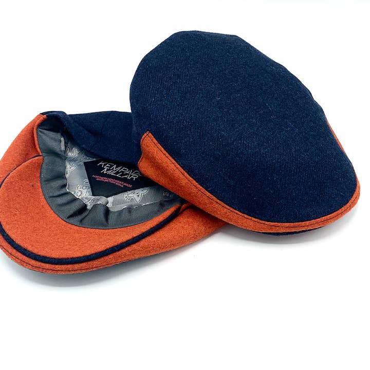 SUPERFLY NAVY ORANGE FLATCAP for wholesale by Kempadoo Millar Headwear