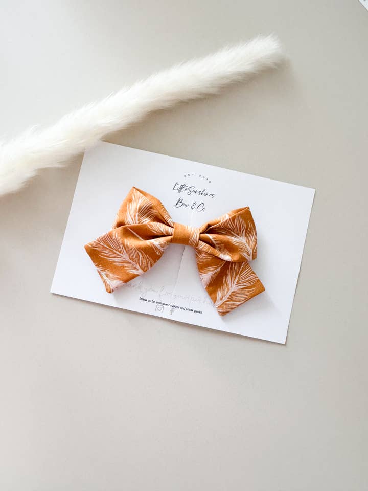 Burnt Orange Feathers Pinwheel Hair Bow for wholesale by Little Sunshines Bow & Co
