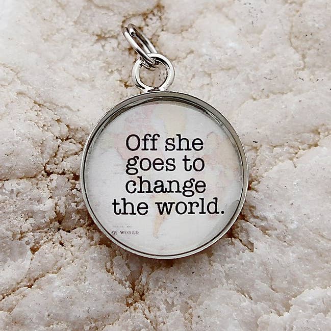 Off She Goes To Change The World Round Charm for wholesale by Jennifer Dahl Designs LLC