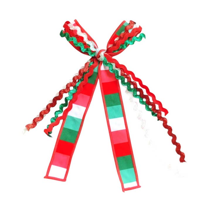 Fiocco per capelli con nastro a righe natalizie con clip per la vendita all'ingrosso da parte di Pretty in Pink Bows