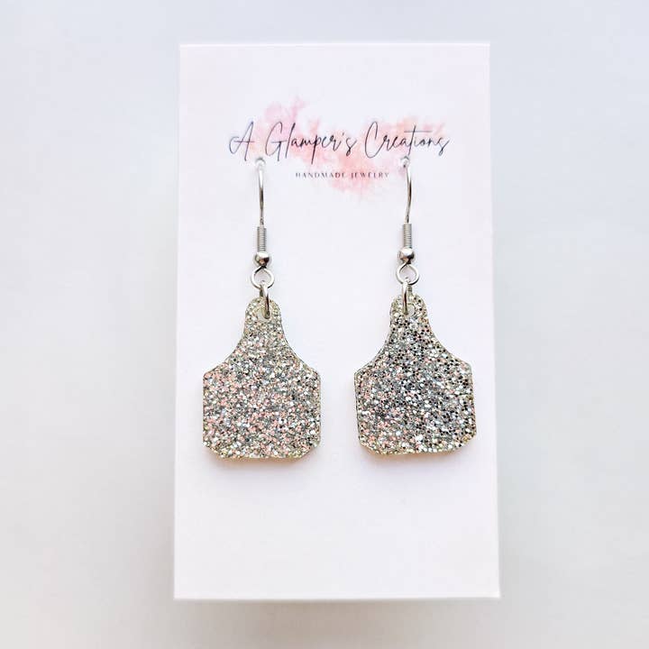 Silberne Glitzer-Kuhmarken-Acryl-Ohrringe für den Großhandel von A Glamper's Creations LLC