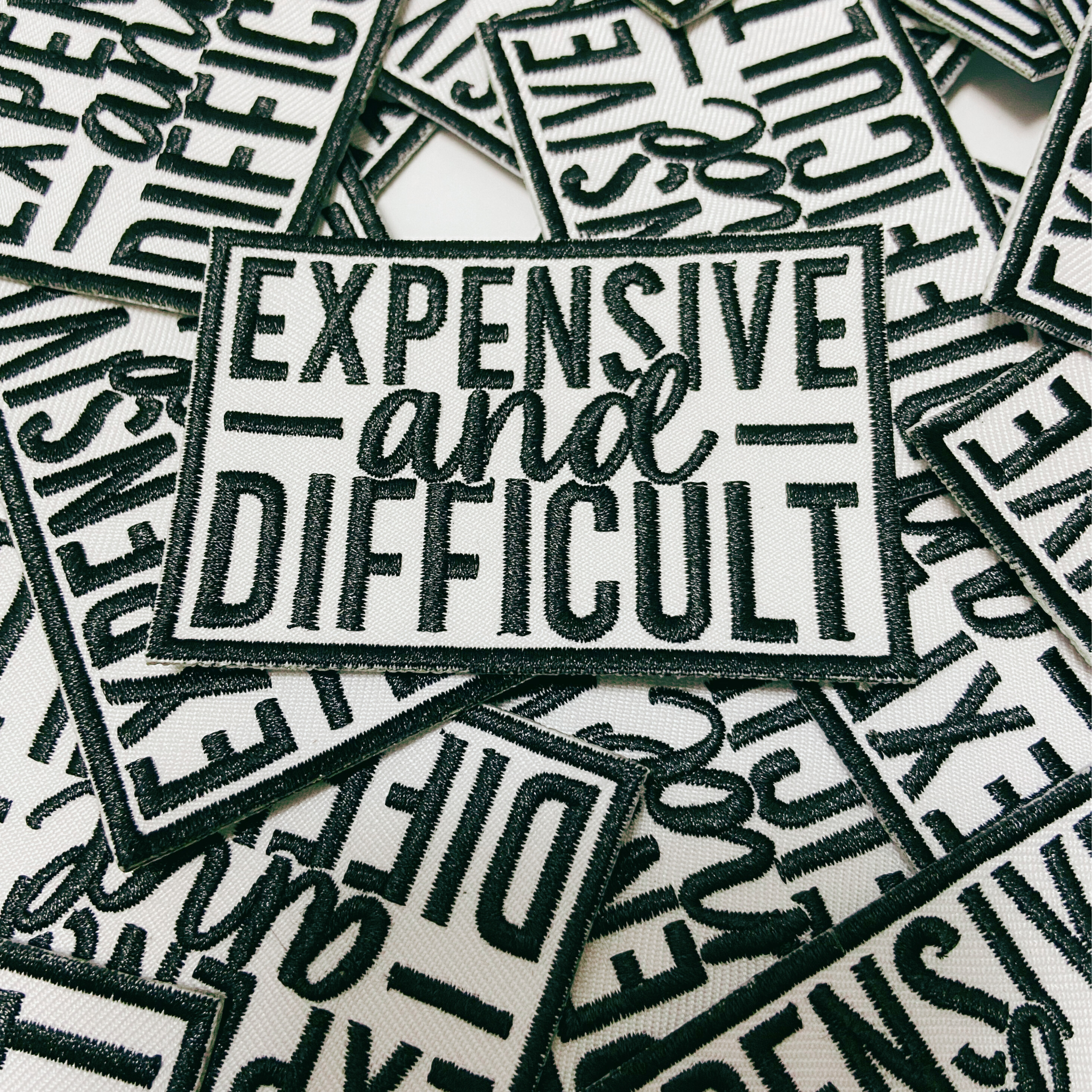 TEELUX - Wholesale Patch - 3" Expensive & Difficult in Black -  Embroidered Hat Patch1