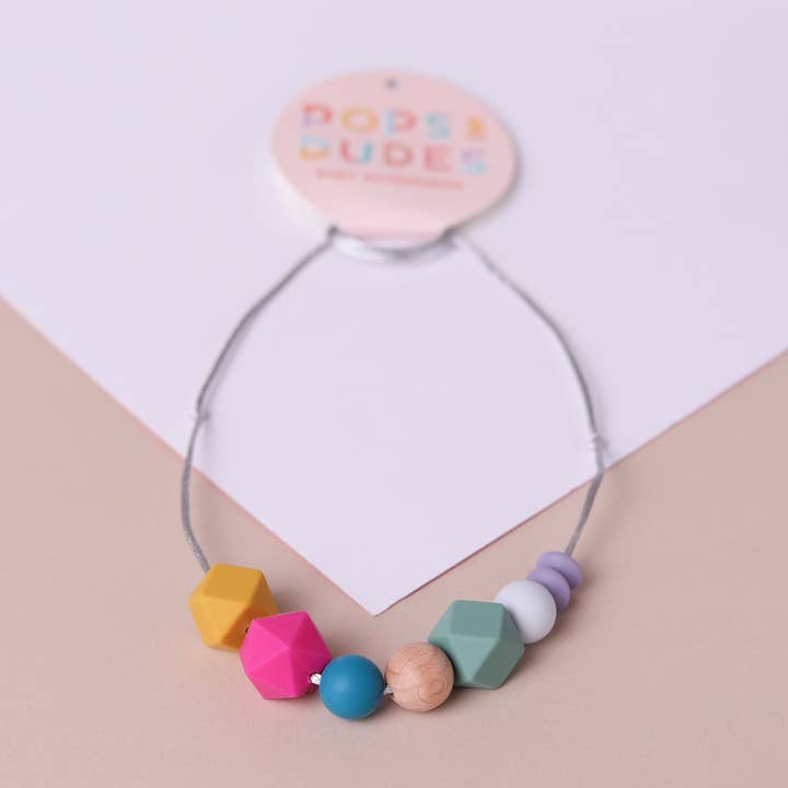 Magenta pop teething necklace for wholesale by Pops and Dudes