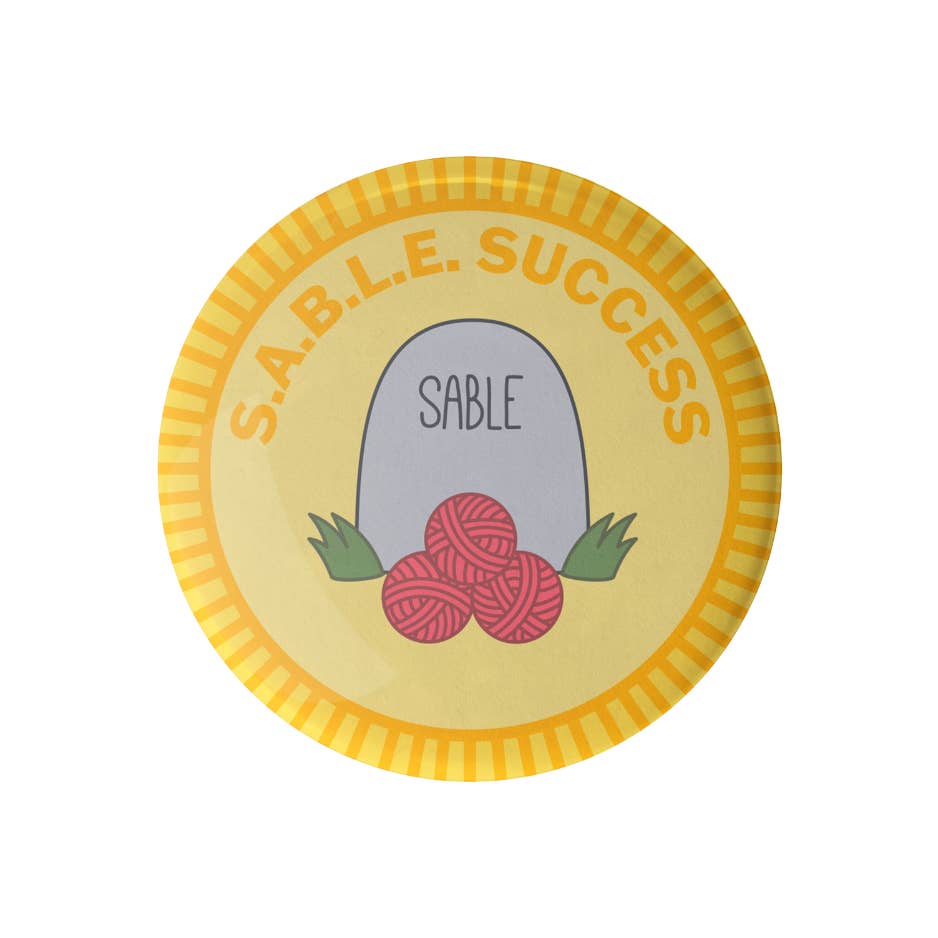 Camp Stitchwood - Vente Épinglettes/boutons - Badge de mérite SABLE Success