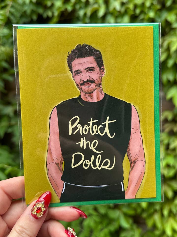 Protect the Dolls (Pedro Pascal) Greeting Card for wholesale by Stacy Marie Stranzl