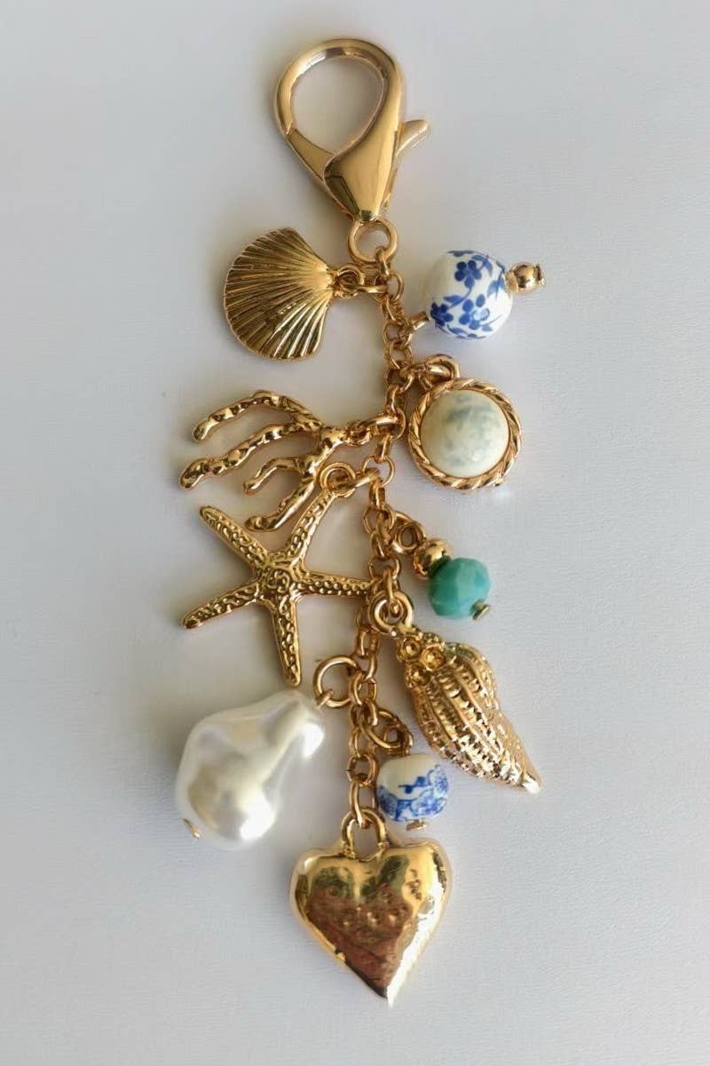 Gold PORCELAIN SEA LIFE PEARL HEART TURQ BEAD BAG CHARM | 80K009 for wholesale on Faire2