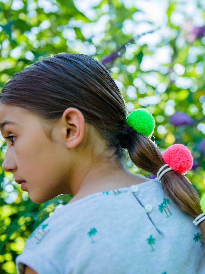 Set di 4 elastici per capelli con pompon al neon per la vendita all'ingrosso da parte di PomPom Galore