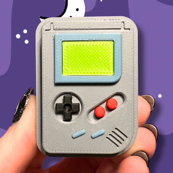 Grå Spilsystem Fidget Legetøj Klikker Nøglering Taskevedhæng for engroshandel hos The Foxy Hipster