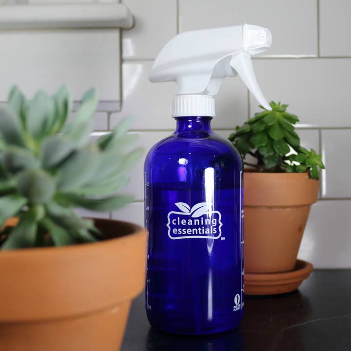 16 oz Blue Glass Spray Bottle for wholesale by Cleaning Essentials