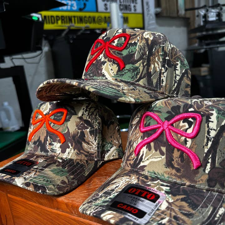 Pyramid Printing & Promotional - Wholesale Hat Accessory - Women's - Camo Bow Embroidered Trucker Hat