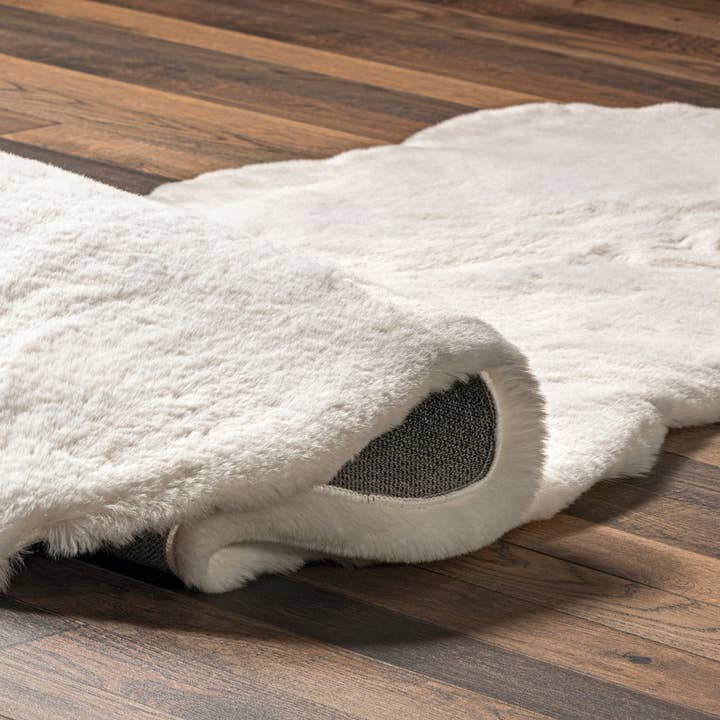 White Eline Faux Sheepskin Machine Washable Area Rug for wholesale on Faire3