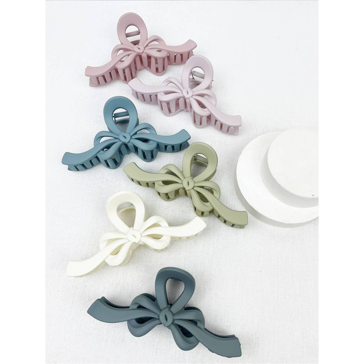 MIX COLOR Knotted Bow Soft Tone Matte Hair Claw for wholesale on Faire5