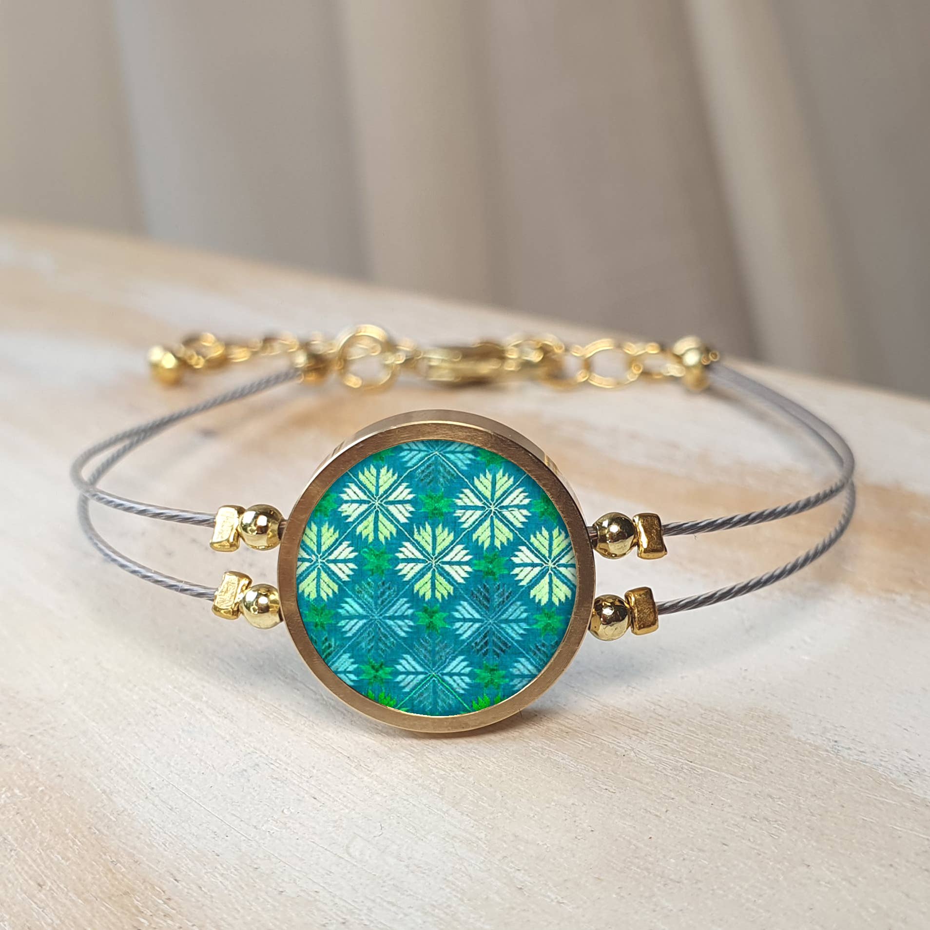 Noa Jewellery – wholesale Charm/dangle bracelet – Round Ceramic Bracelet, Gold Plated Stainless Steel Frame25