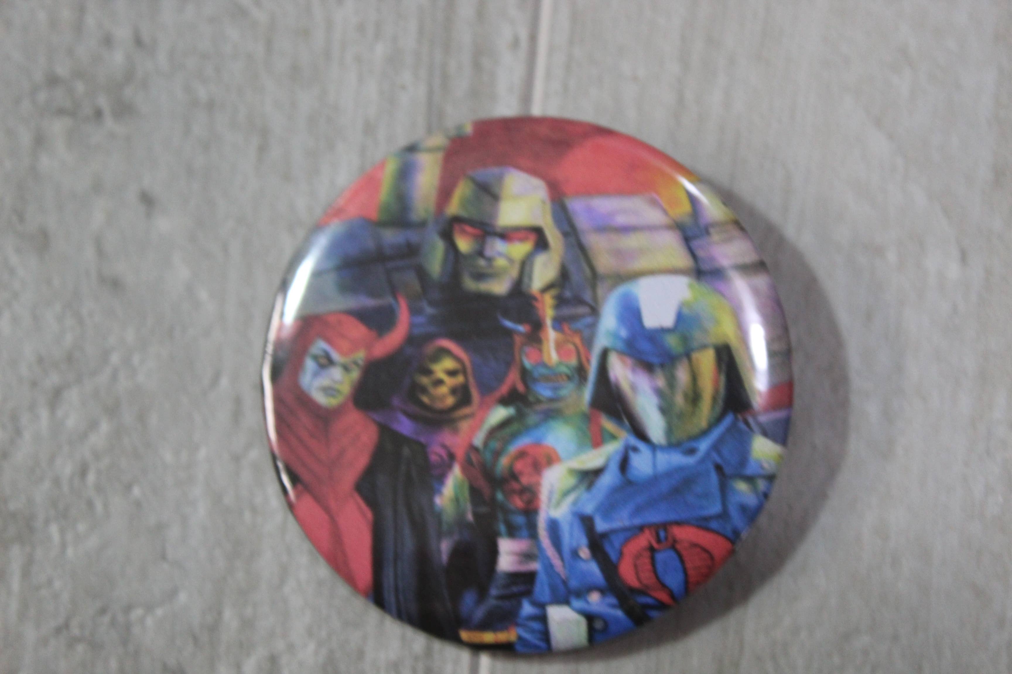 Raven Design - Wholesale Lapel Pin/Button - 1980's cartoon bad guys, metal backed button 2.25 inches0