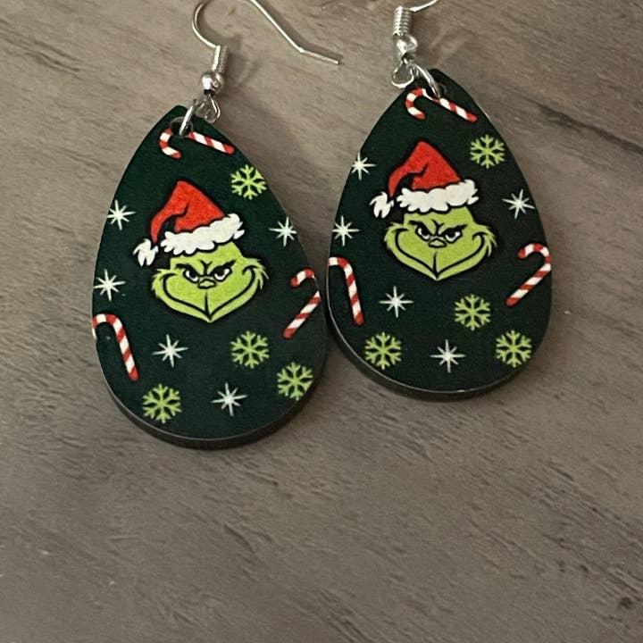 Sublimation earrings grinch for wholesale by Bee Creative