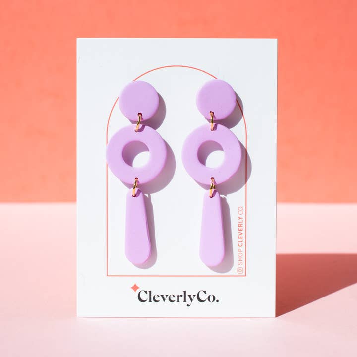 The "Packs a Punctuation" Earrings in Warm Lavender for wholesale by CleverlyCo.