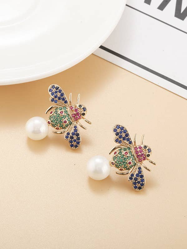 Orecchini in Zirconia Cubica con Perla d'Ape E7658 per la vendita all'ingrosso da parte di Ole