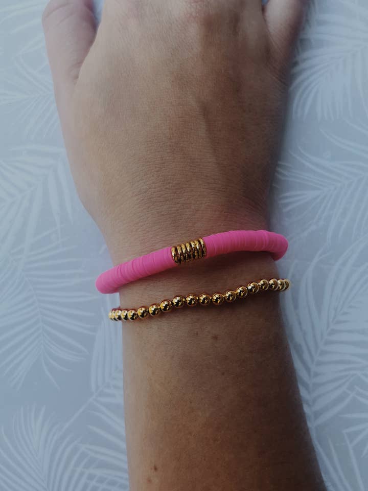 Neon pink heishi beaded bracelet for wholesale by The western jewel