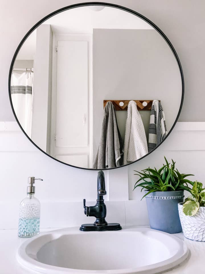 Cheyenne Black Round Framed Mirror for wholesale by Frame My Mirror, LLC