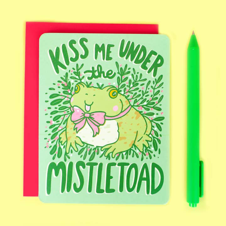 Lustige Winterkarte „Kiss Me Under the Mistletoad“ für den Großhandel von Turtle's Soup