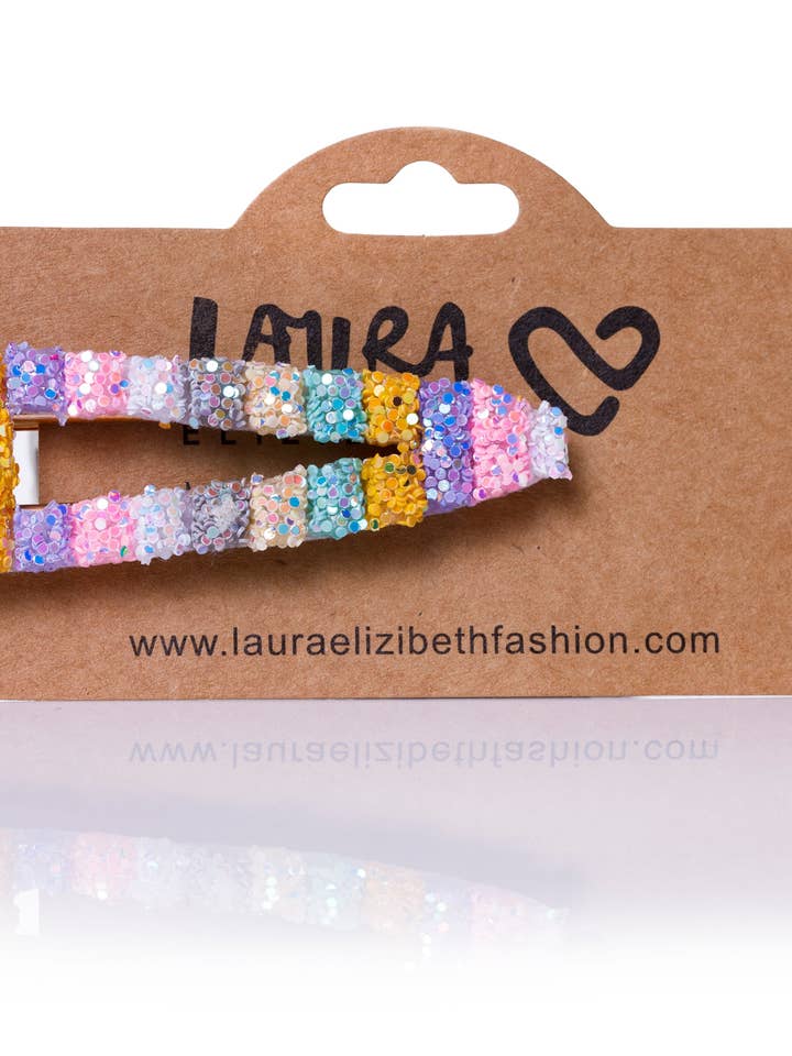 CLIP CON PURPURINA MULTICOLOR DE BOMBAY para venta al por mayor de Laura Elizibeth Fashion Limited