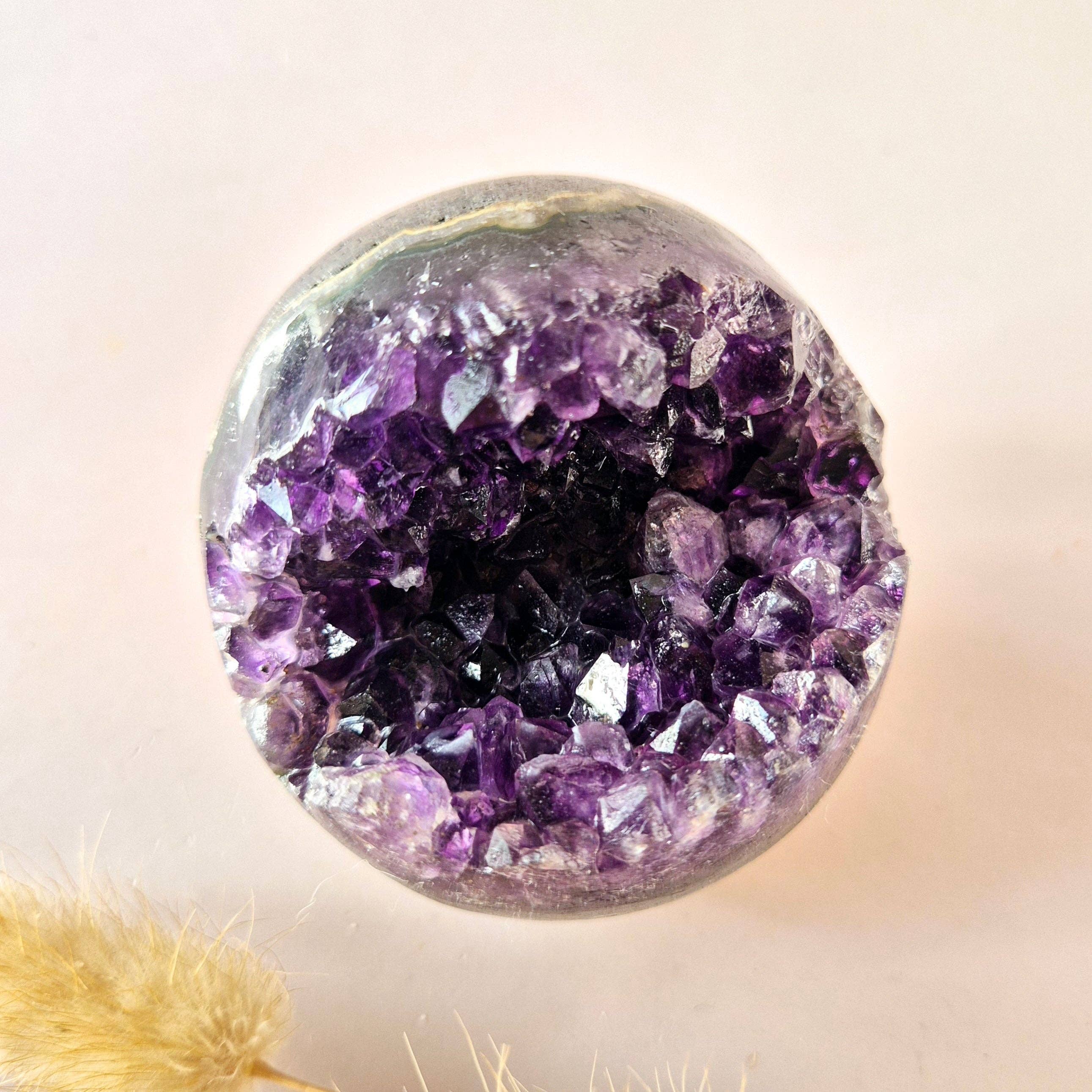 Moonlight Gemstones – wholesale Spiritual stone/crystal – High Quality Gemstone Amethyst Geode Sphere (60–70 mm)1