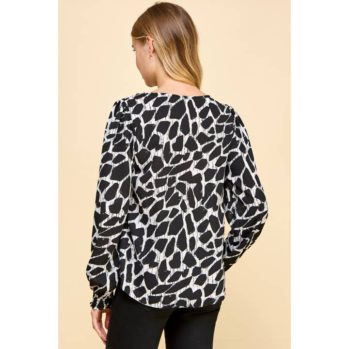 Black Abstract Print top with Smocked Sleeves for wholesale on Faire