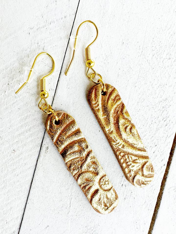 Metallic Gold on Brown Leather Rounded Bar Earrings for wholesale by Boho By Design