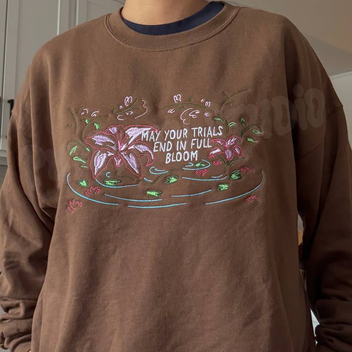May Your Trials End In Full Bloom Embroidered Sweathsirt for wholesale by Purpleth Studio