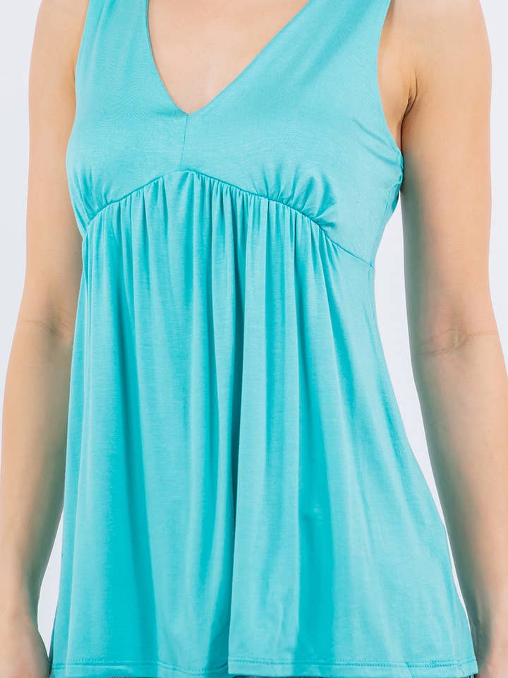 Enfärgad ärmlös damtopp med empireliv för wholesale av ClickPuff