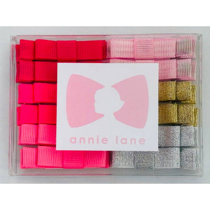 Scatola di 12 fiocchi per capelli - coppie solide 7 per la vendita all'ingrosso da parte di Annie Lane