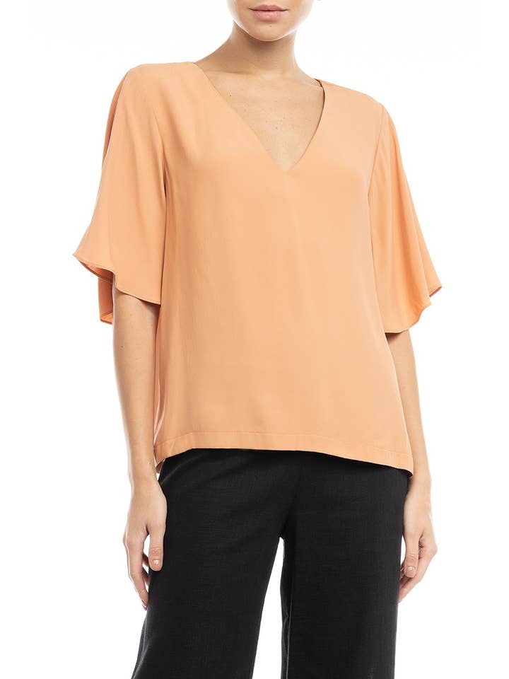 Bluse med sommerfugleærmer og V-udskæring for engroshandel hos Naked Zebra