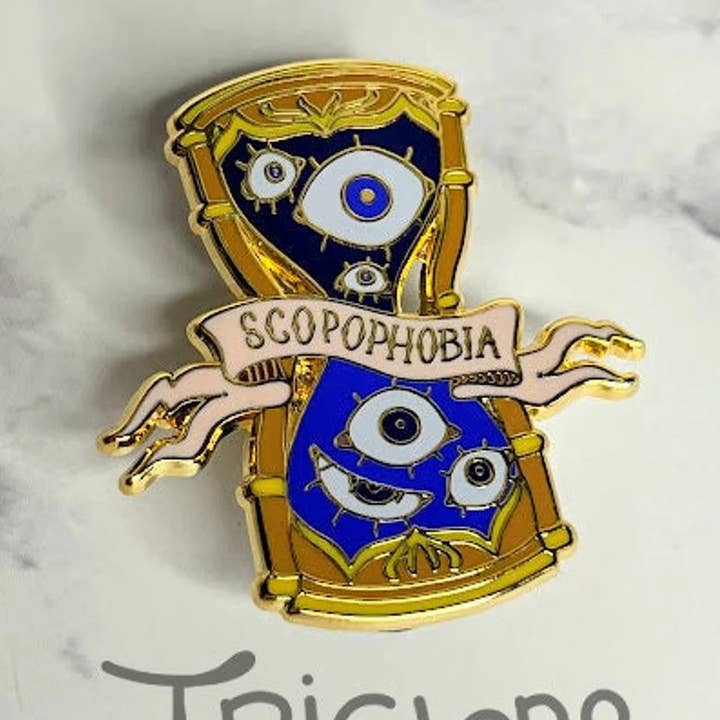 Scopophobia Hourglass Enamel Pin for wholesale by Triclops Rabbit