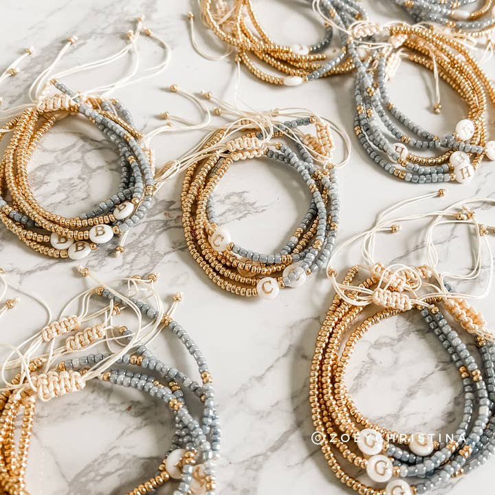 Dainty Initial Bracelets in Blue & Gold  - Individual and other Purchase Wholesale initial. Free Returns & Net 60 Terms on Faire trending on Faire.