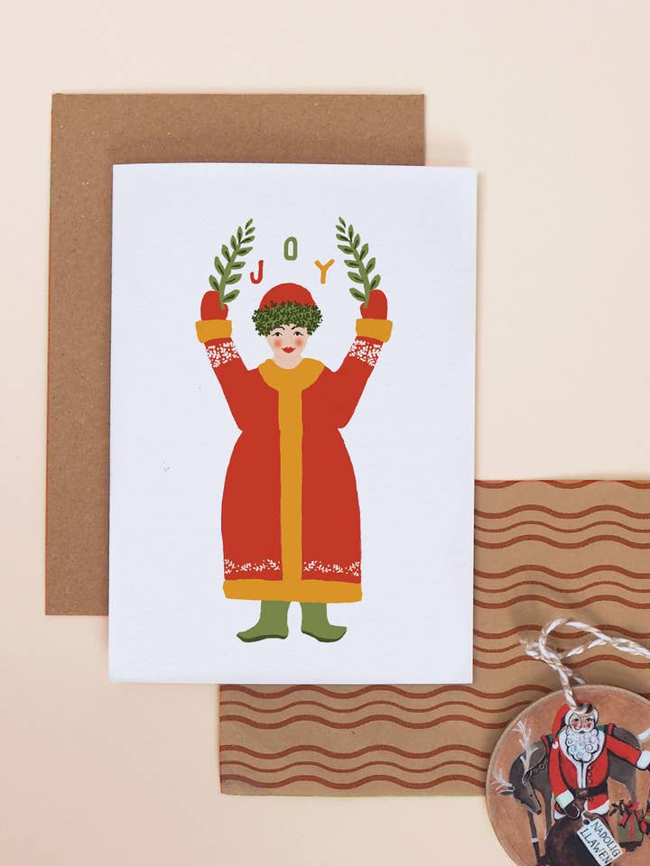 Biglietto natalizio tradizionale scandinavo con scritta «Joy» per la vendita all'ingrosso da parte di Jade Fisher