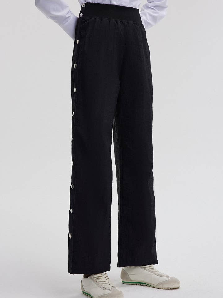 PANTALONI IN COTONE CON VITA ELASTICA E DETTAGLIO DI BOTTONI A PRESSIONE per la vendita all'ingrosso da parte di Touché Privé EU