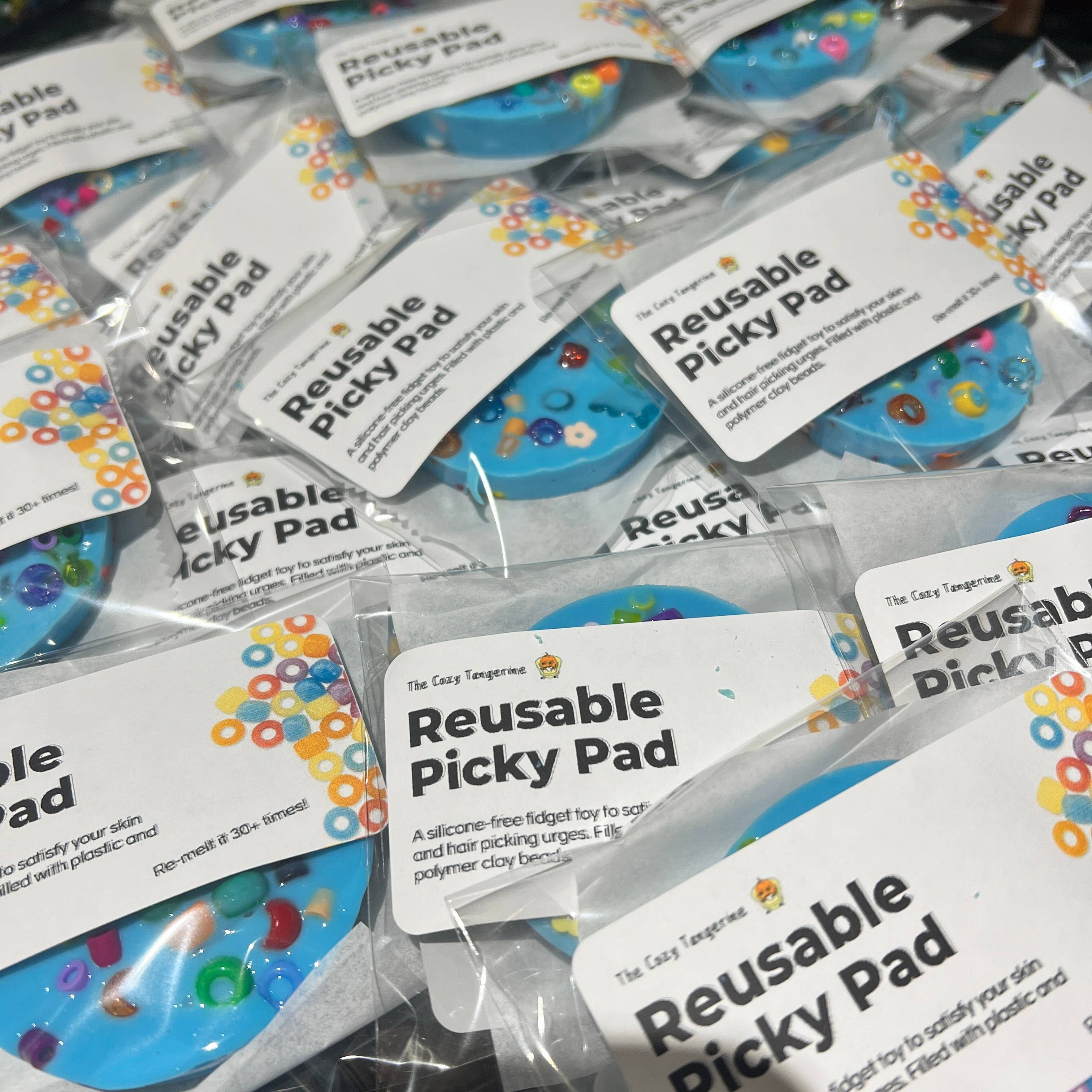 The Cozy Tangerine – Engroshandel Klistermærke – Genanvendelig picky pad | Sansestimulerende legetøj til hud- og hårplukning3