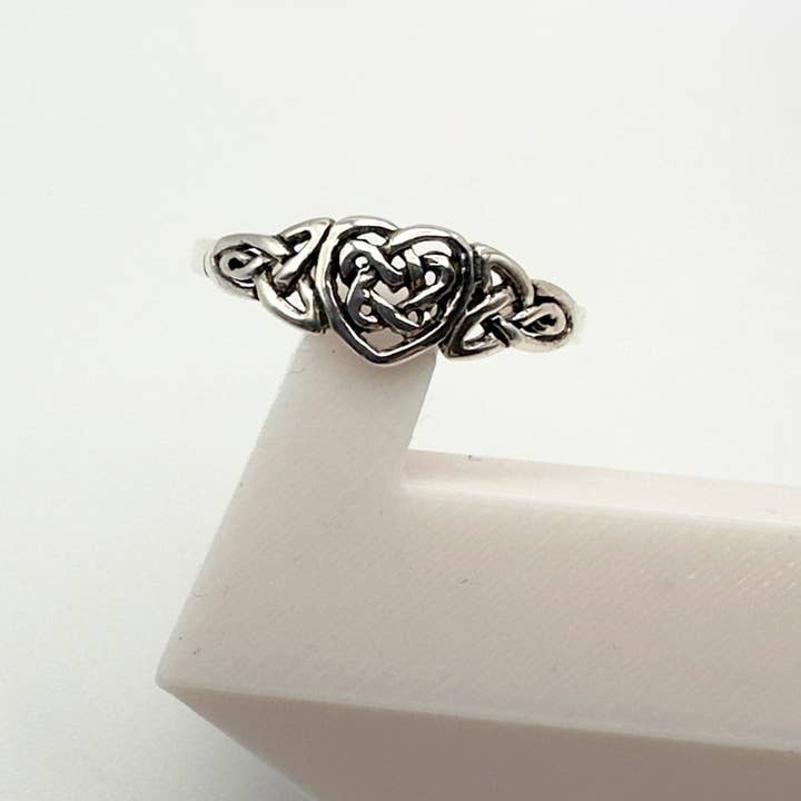 Forever Intertwined: Celtic Heart Knot Ring in Sterling Silver for wholesale by The Green Gecko