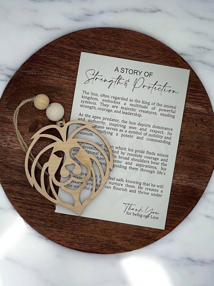A Story of Strength & Protection Lion Wooden Ornament for wholesale by Montgomery and Claire