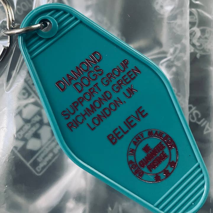 The 3 Sisters Design Co. - Wholesale Keychain - Unisex - Motel Key Fob - Diamond Dogs Support Group (Ted Lasso)