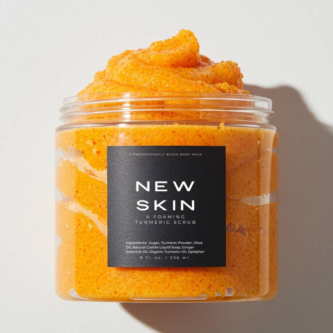 NEW SKIN, A FOAMING TURMERIC SCRUB for wholesale by Predominantly Black Candle Haus