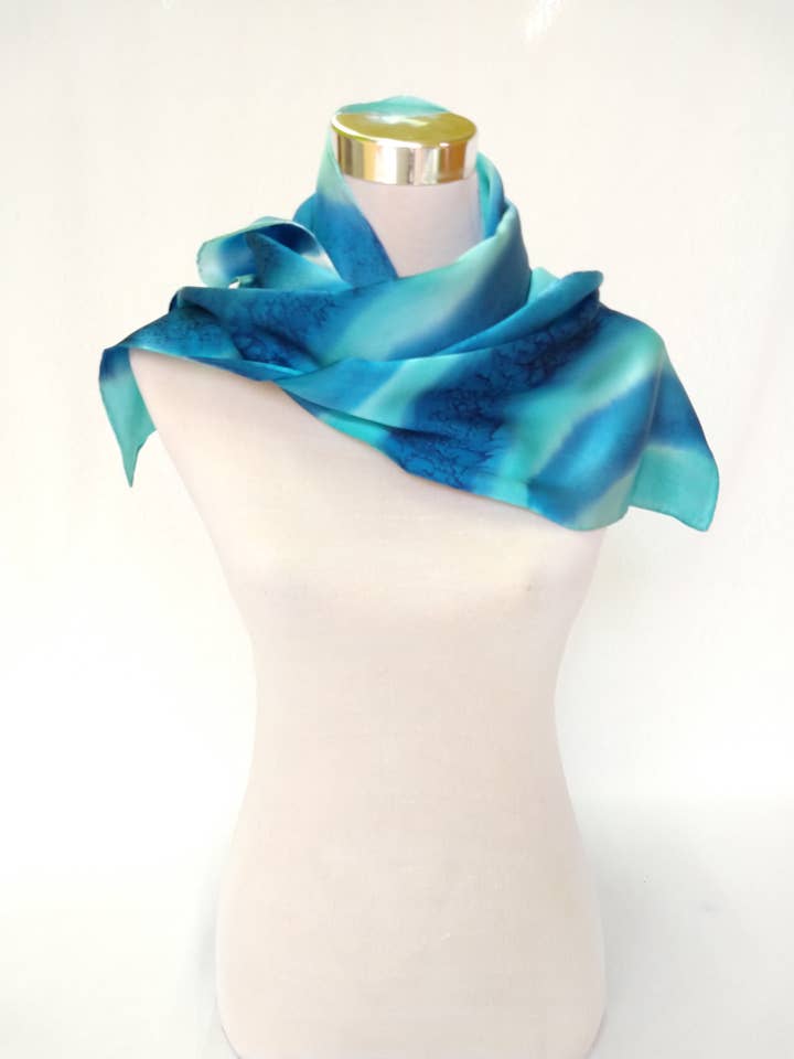 Blue satin hand painted silk scarf medium size for wholesale by CONCHA BLANCH