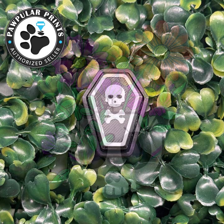 Cercueil Crâne et Os Croisés Fidget Clicker pour la vente par Vibrant Xpressions