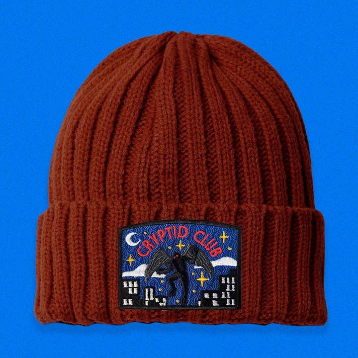 Mothman Cryptid Club Cable Knit Beanie for wholesale by The Space Bureau
