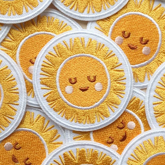 Happy Sun Embroidered Iron On Patch for wholesale by The Moonlit Press