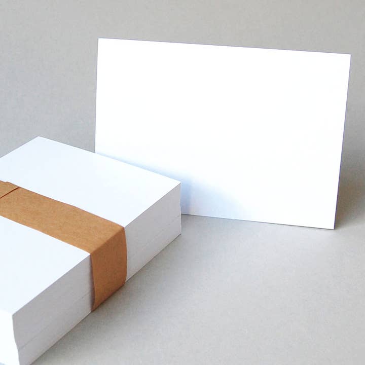 100 helt vita tomma vykort i DIN A6 för wholesale av Kettcards
